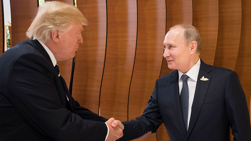 Donald Trump shake hands with Vladimir Putin